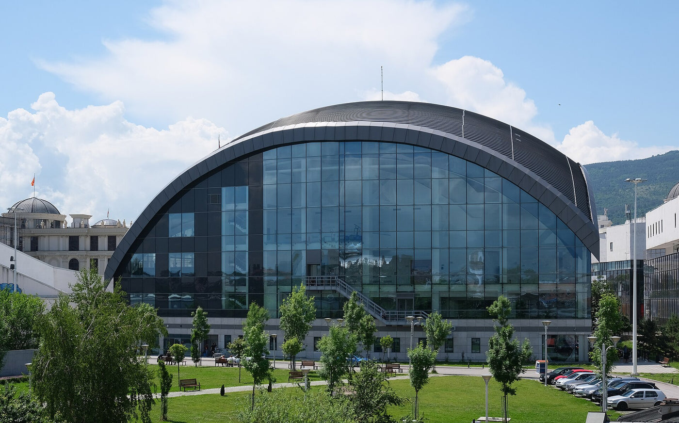 The Macedonian Philharmonic seen from the Vardar side, with its glass wall and lawn