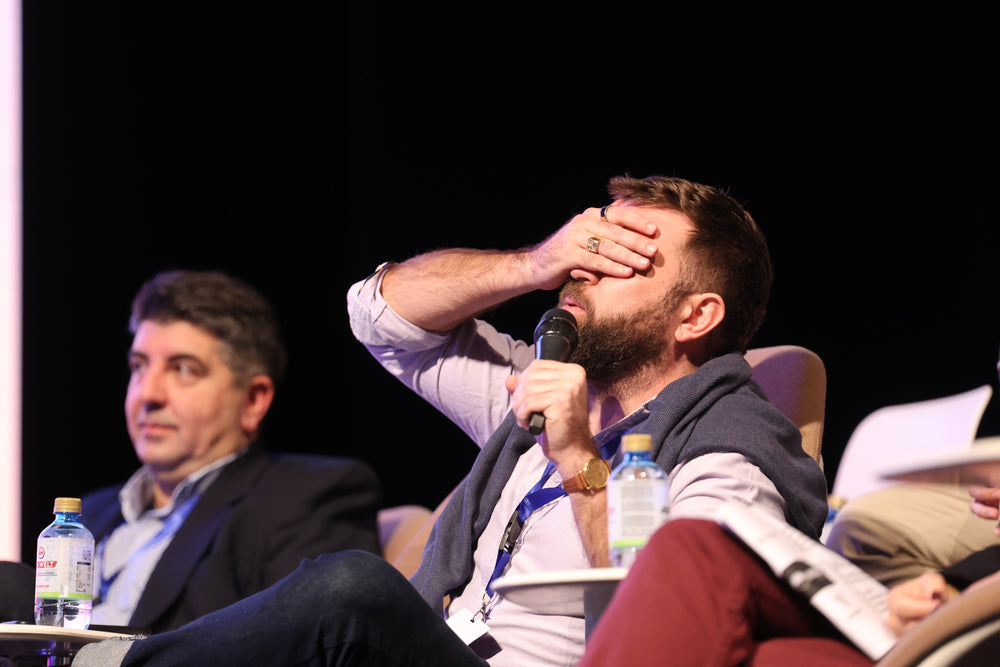 Audience leaning in during the regional pitch final.