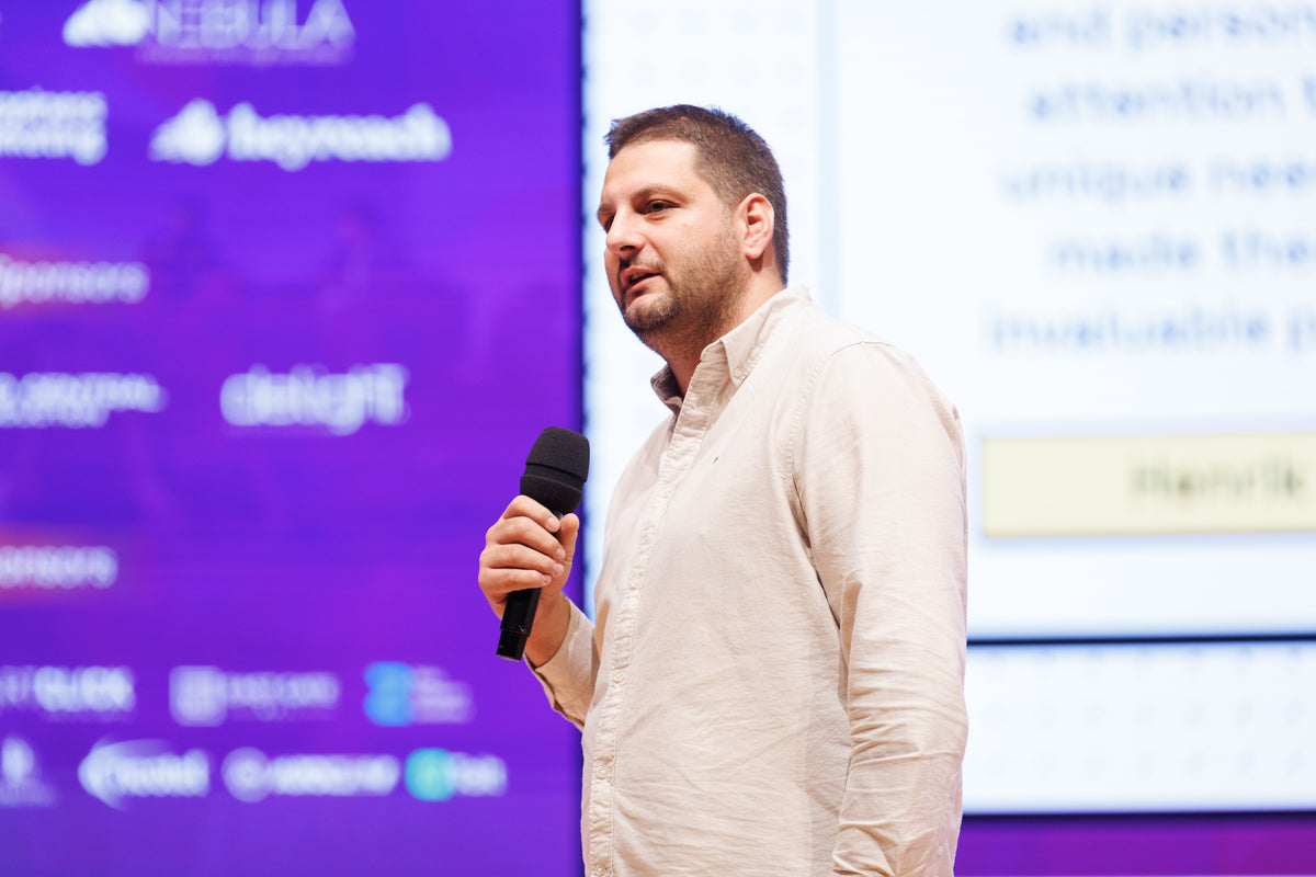 Founder onstage during a live product reveal.