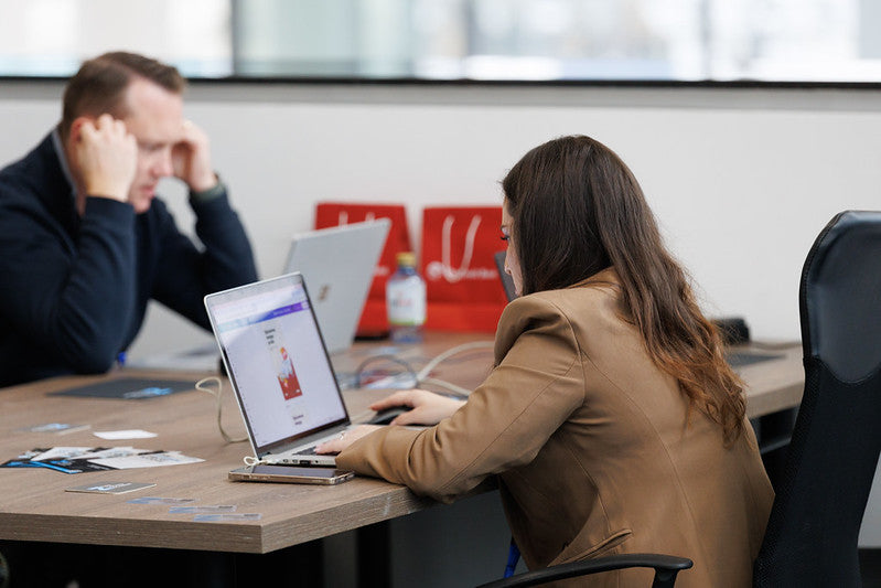 Early-stage founders collaborating around a working session table.