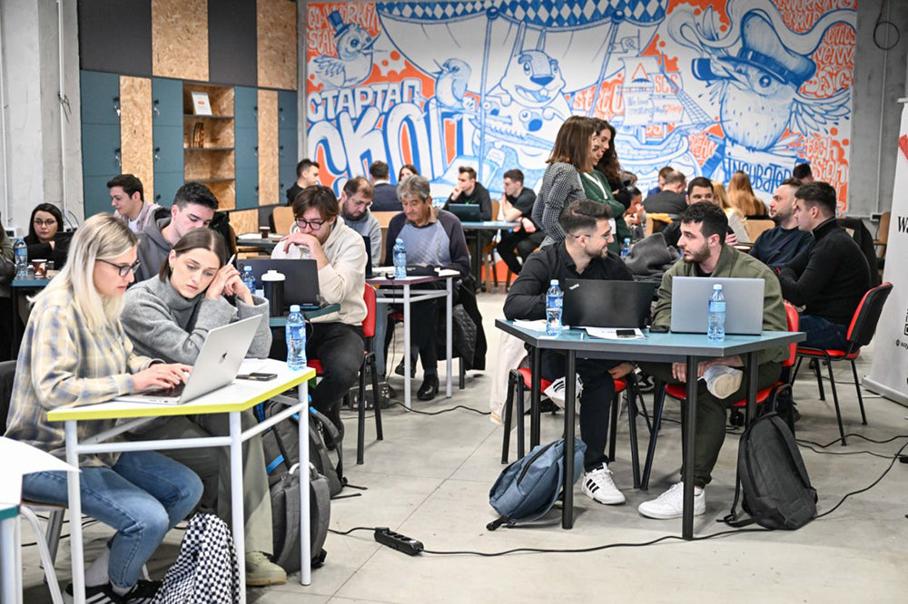 Students whiteboarding an idea during a hackathon working session.